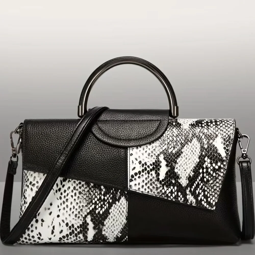 Luce black and white snakeskin clutch bag